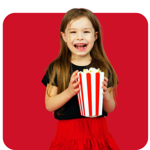 South Texas Girl Cub Scout laughing eating popcorn.