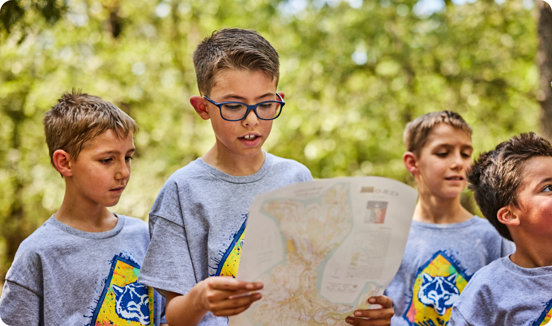 Cub Scout boys reading a map